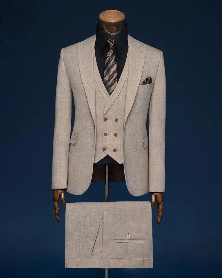 Premium tan three piece pant coat suit with double breasted waistcoat on mannequin